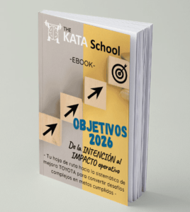 Portada del ebook “Objetivos 2026” de The Kata School, con diseño en tonos gris y amarillo, flechas ascendentes y un icono de diana que simbolizan progreso y logro de objetivos mediante Toyota Kata.